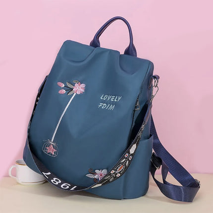 Floral Embroidery Double Handle Backpack Waterproof Multifunctional Travel Bag for Women. Wide Capacity Oxford Exterior Polyester Interior Canvas Straps Zipper Closure. Perfect for Outdoor Occasions. Blue Shade.